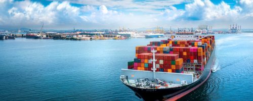 aerial-side-view-of-cargo-ship-carrying-container-and-running-for-export.jpg